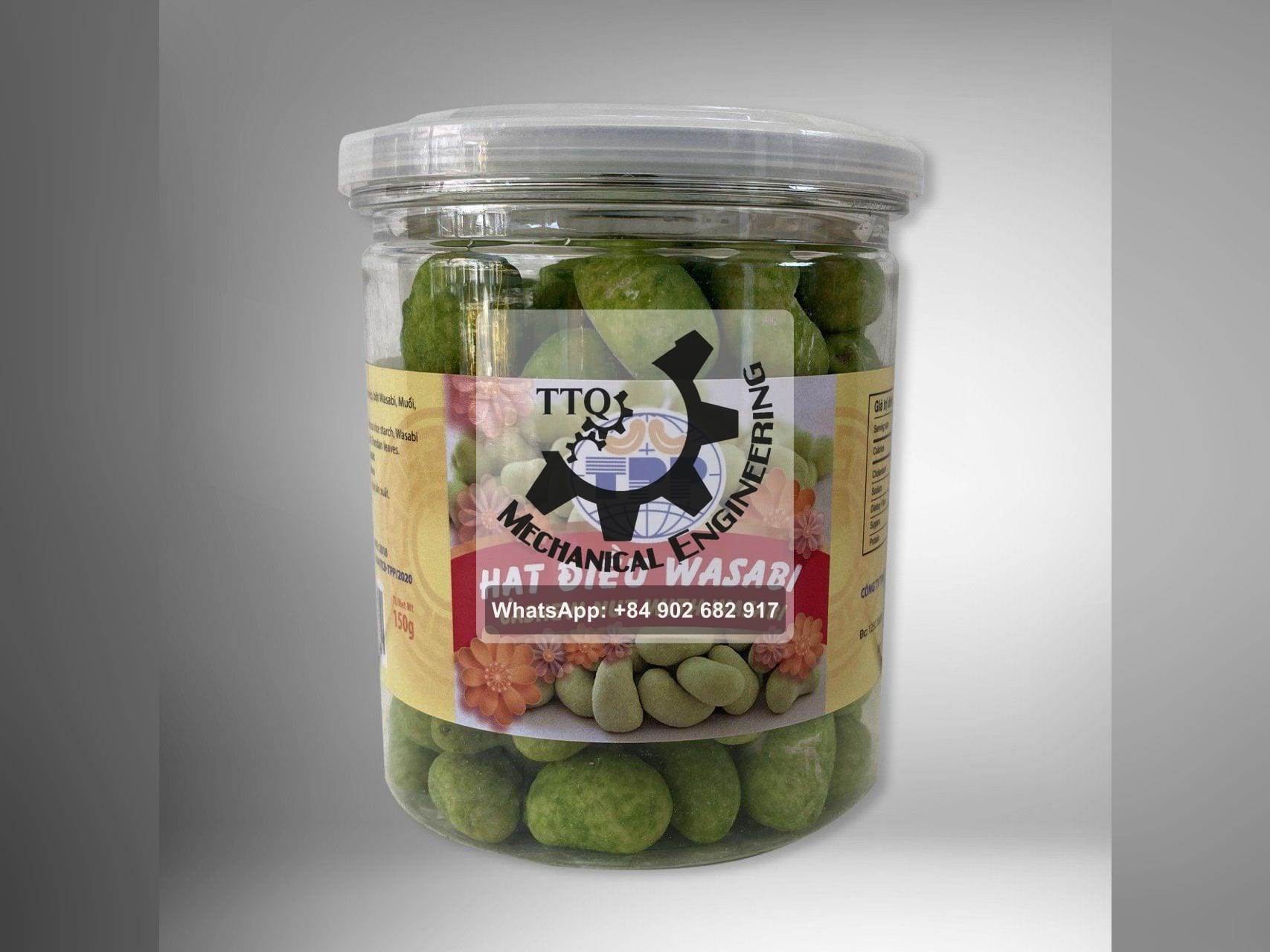 A 150 g retail jar of wasabi-coated cashew kernels on a plain background