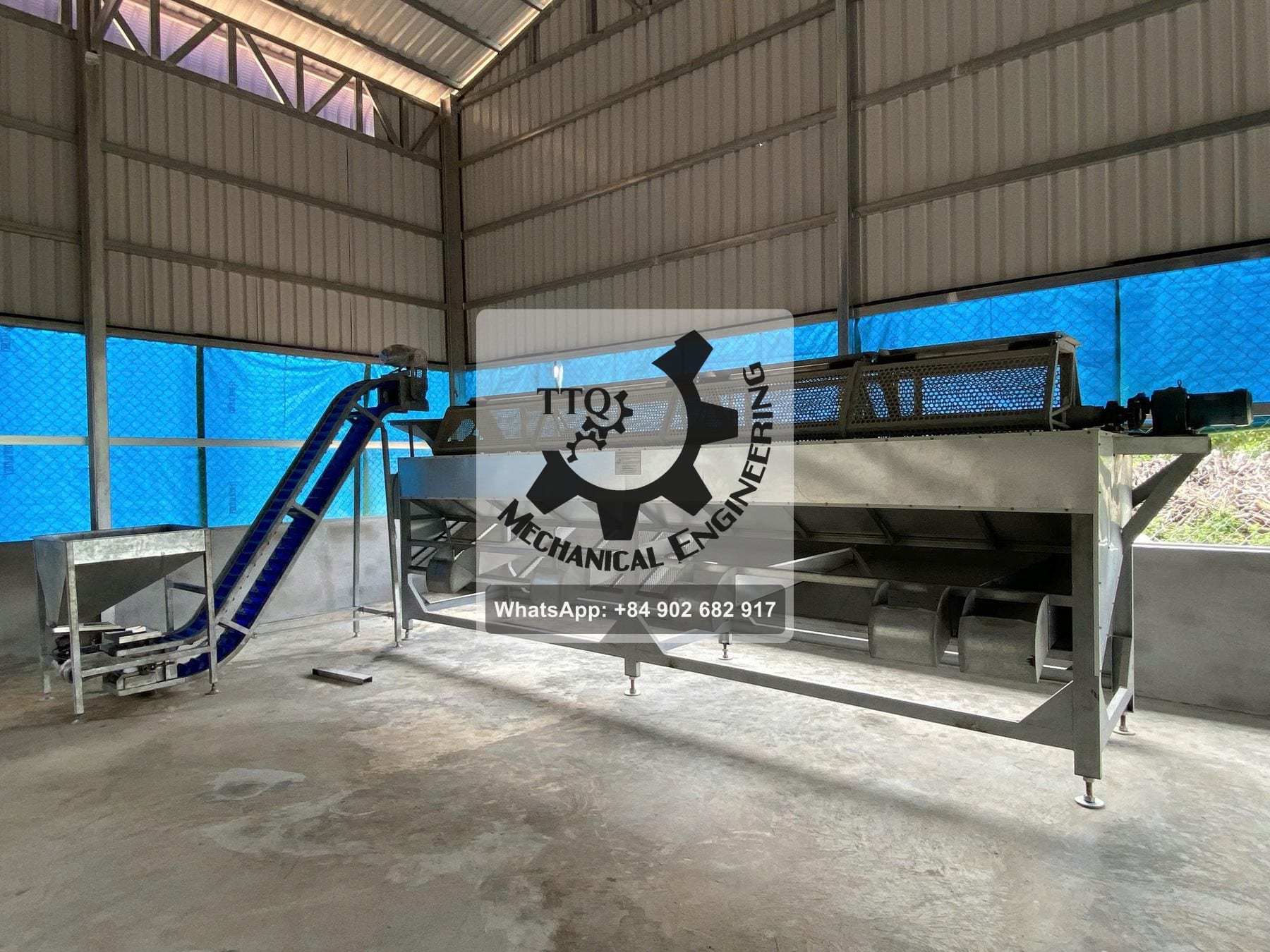 Installed RCN grading machine showing the separate discharge chutes along the underside