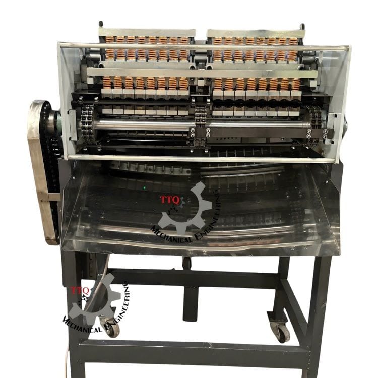 Head-on view of the TTQ 16 Head cutting machine showing the sprung nut holders